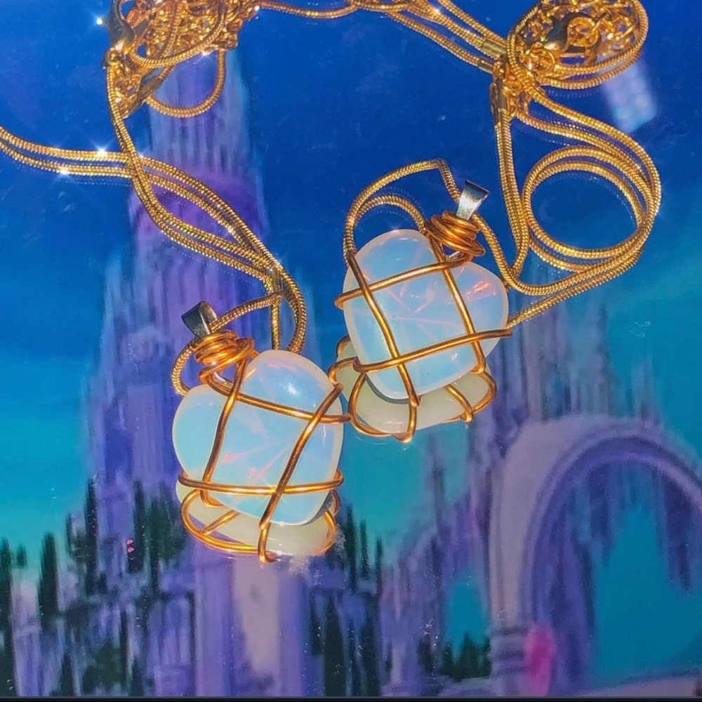 Two Barbie diamond castle necklaces